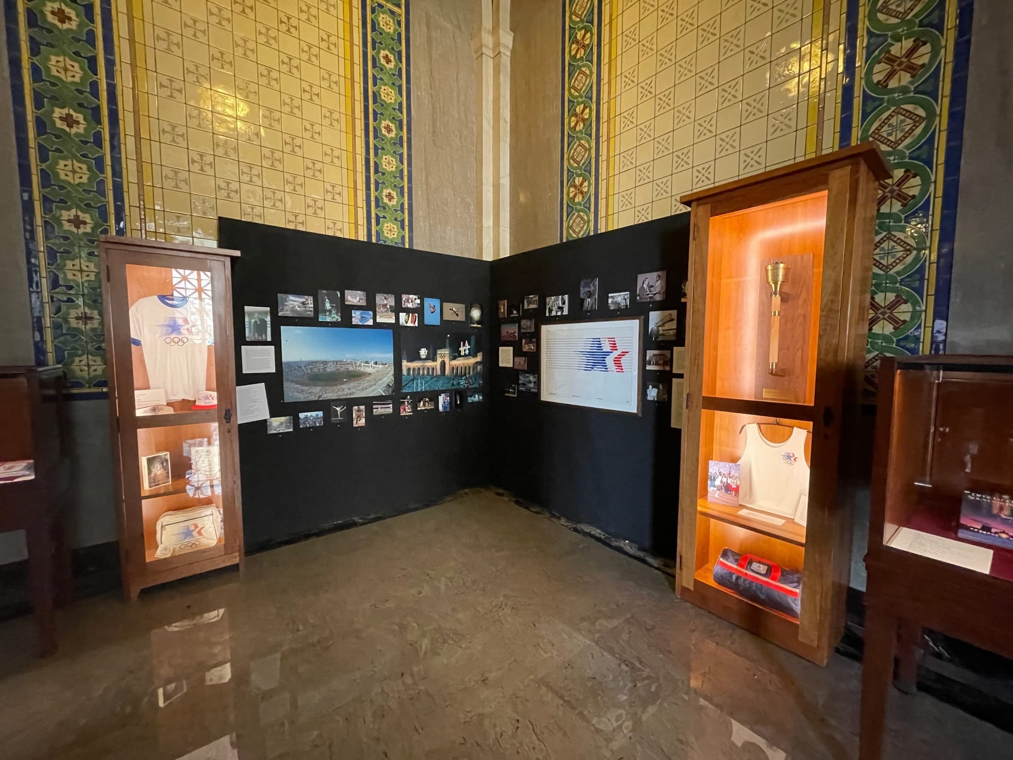 An installation of 1984 Olympics memorabilia installed on a wall in City Hall