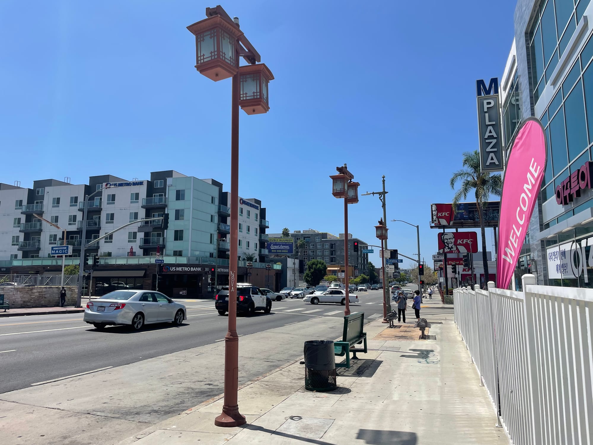 Decorative streetlights meant to look like lanterns at a bus stop along Olympic