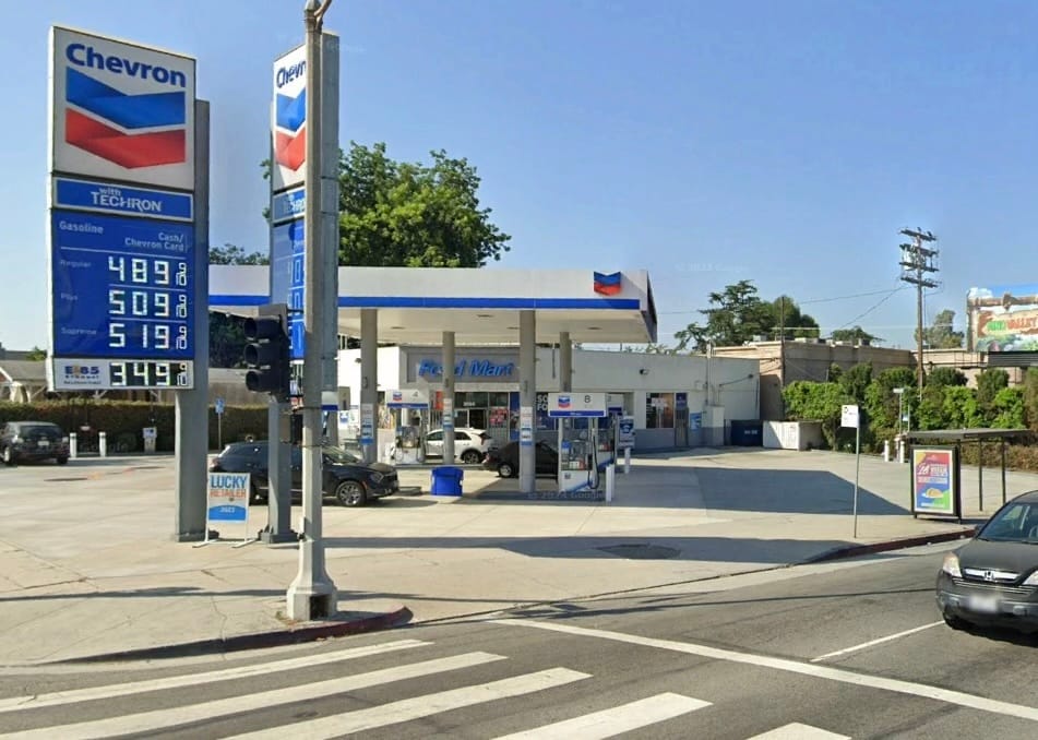 A Chevron station with a HUGE shade structure over the gas pumps