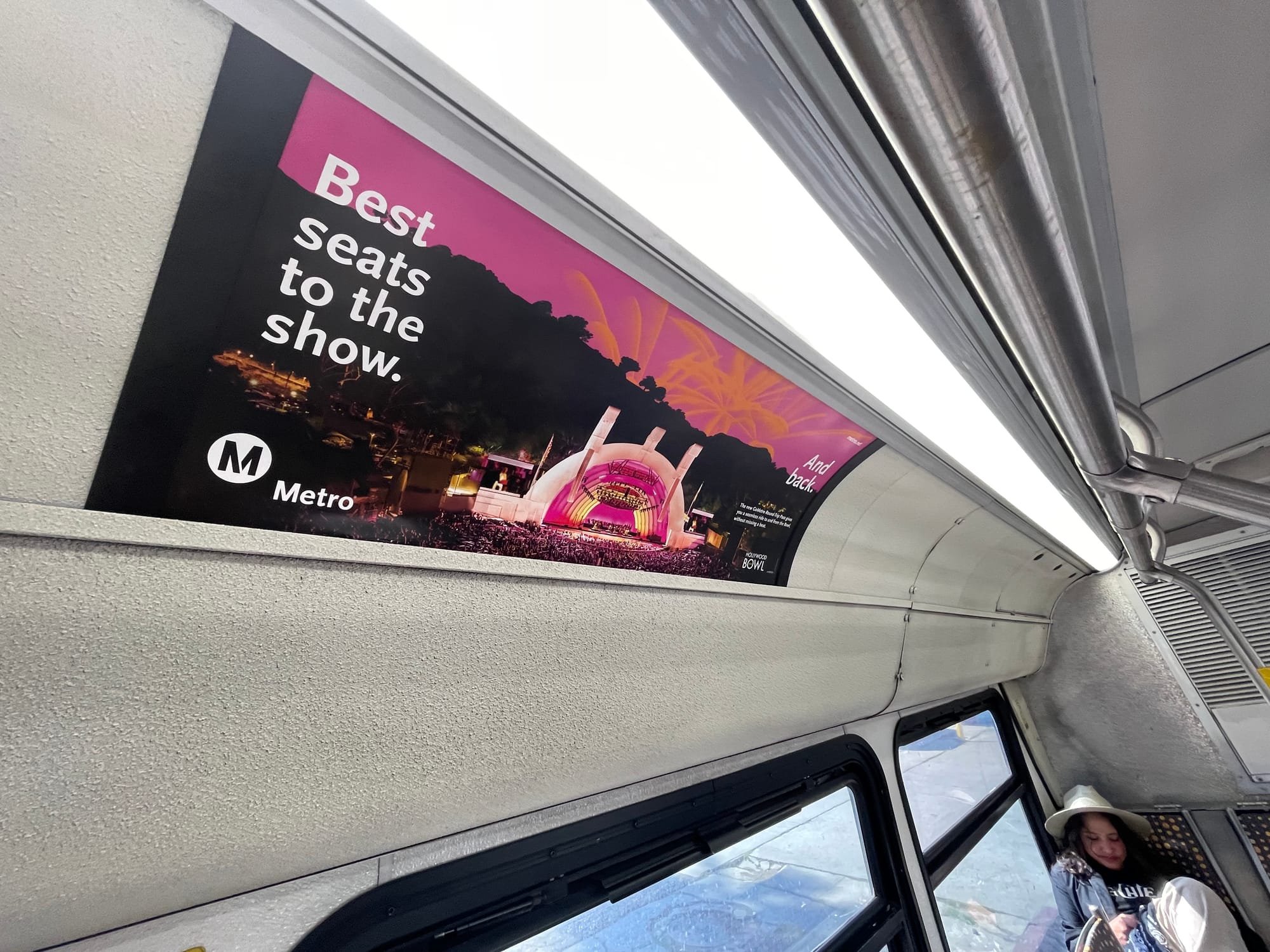 An ad for the Metro service to the Hollywood Bowl on the inside of a bus. The ad says "Best seats to the show. And back."