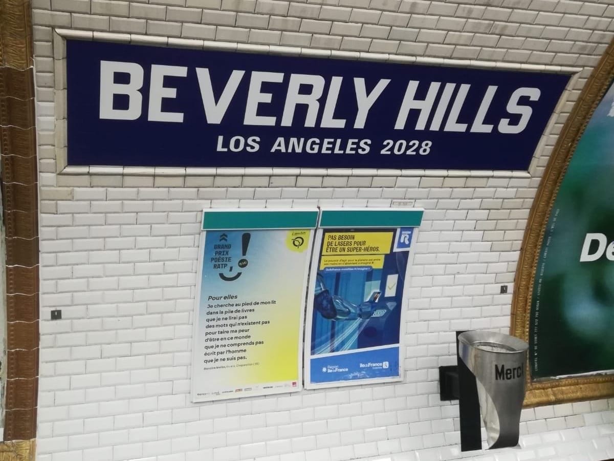 A Paris metro station with its signature white tile renamed to say BEVERLY HILLS Los Angeles 2028