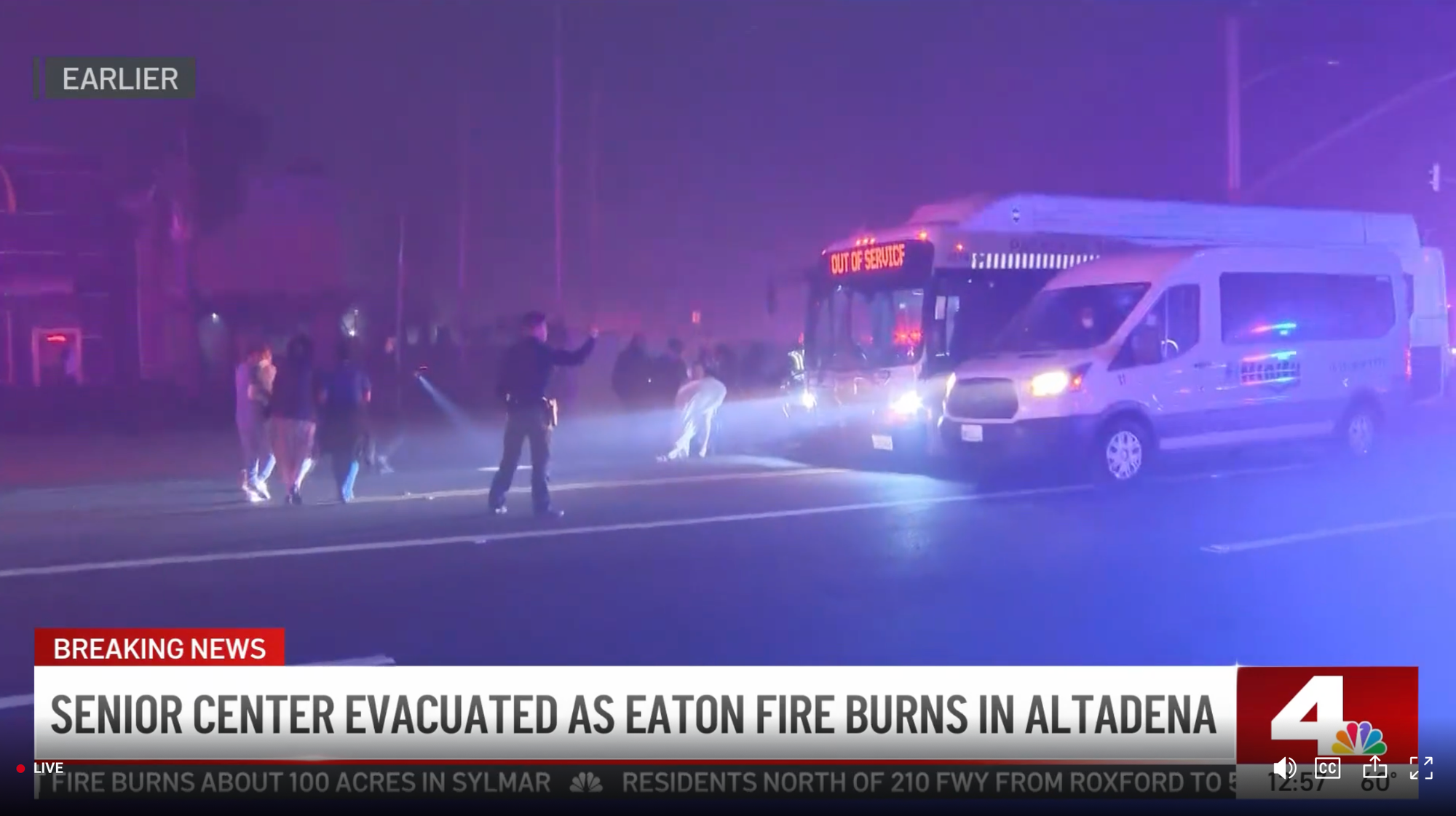 A screengrab from NBC 4 that says senior center evacuated as Eaton Fire burns in Altadena, showing people being loaded onto a bus during a fire 