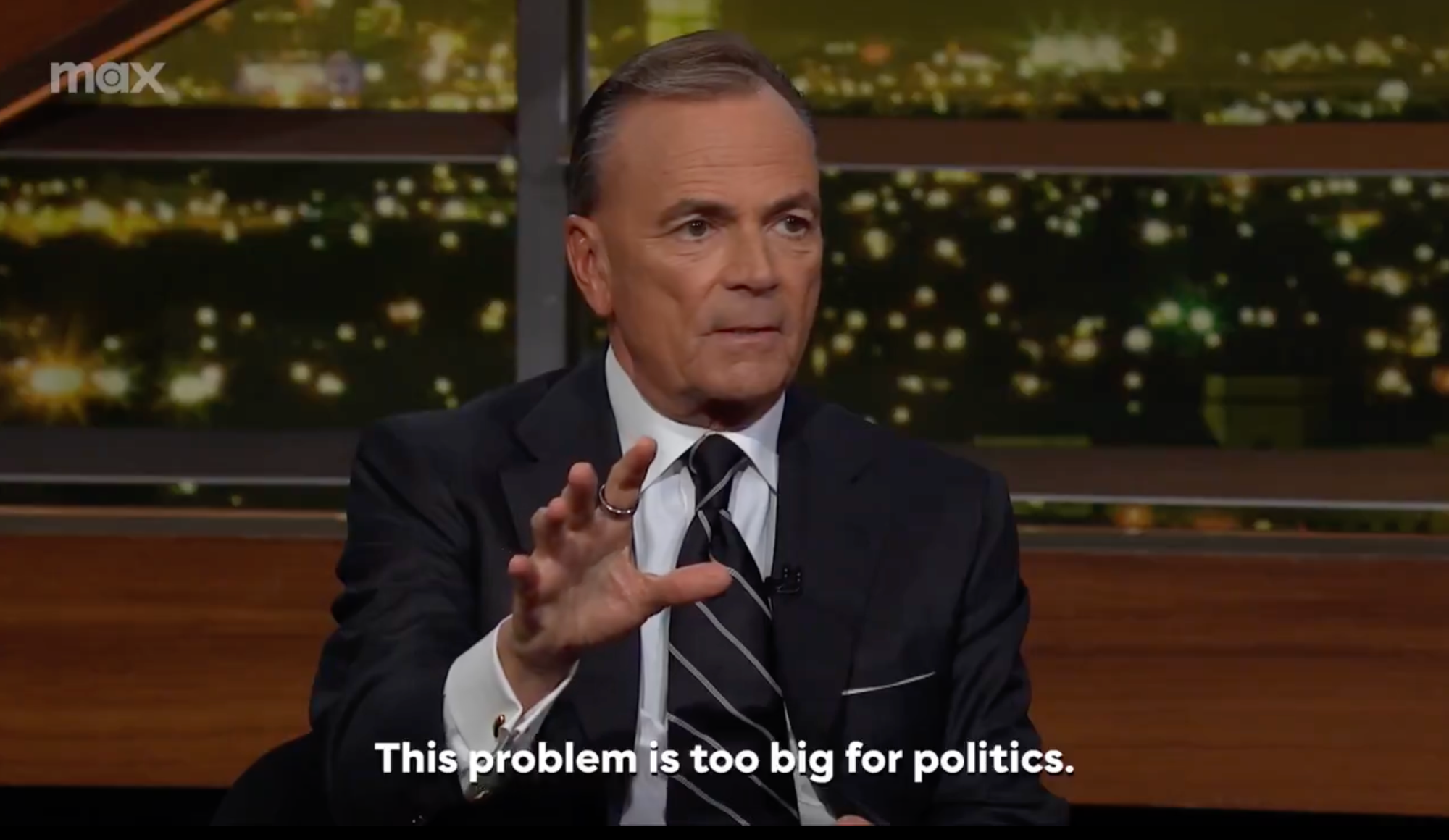 Developer Rick Caruso in a well-tailored suit sitting in a TV studio and the caption reads: This problem is too big for politics